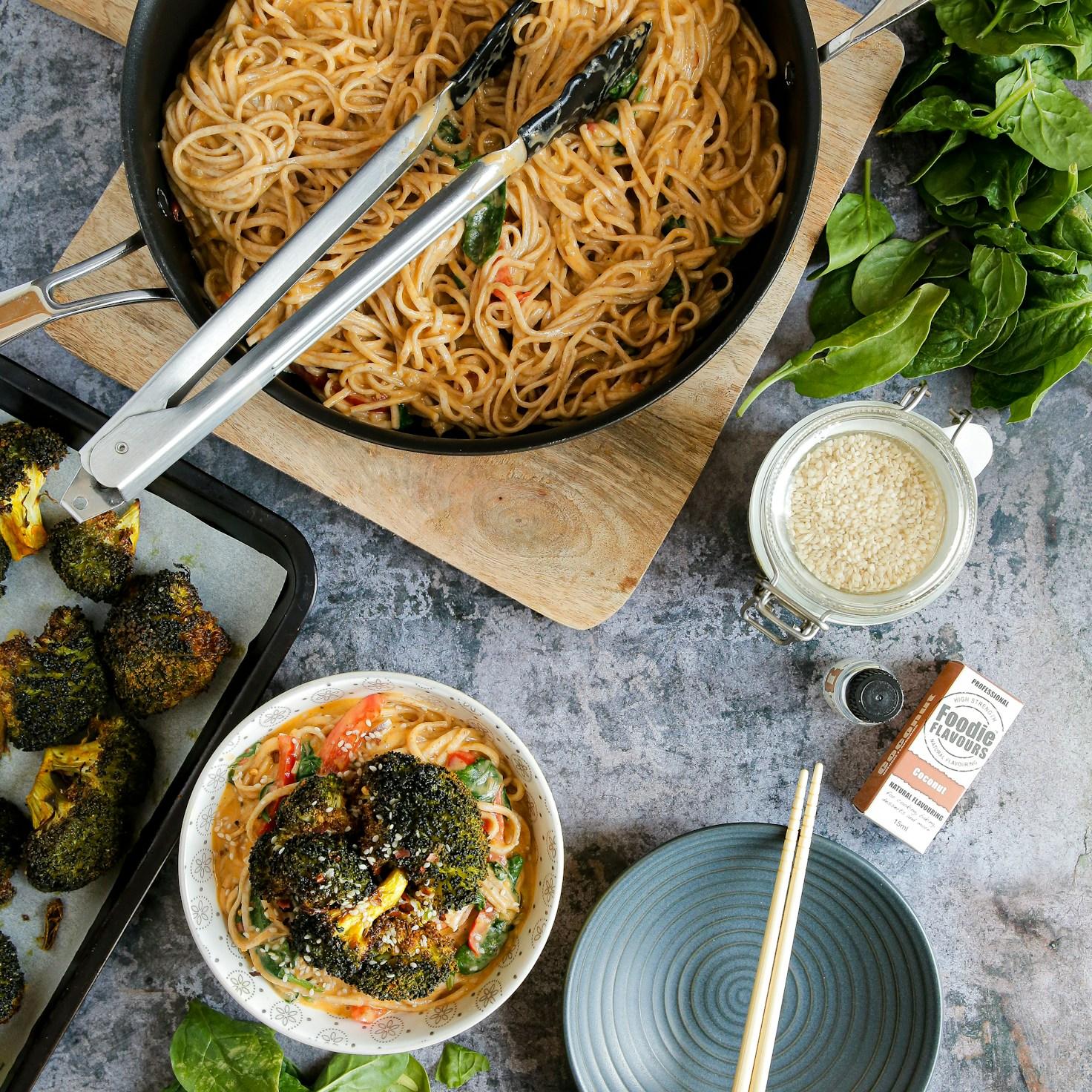 Members collaborating in a contemporary kitchen, exchanging recipes and techniques